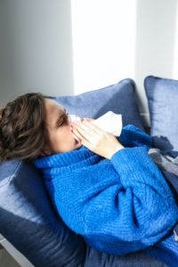 Girl sneezing from allergies in albuquerque