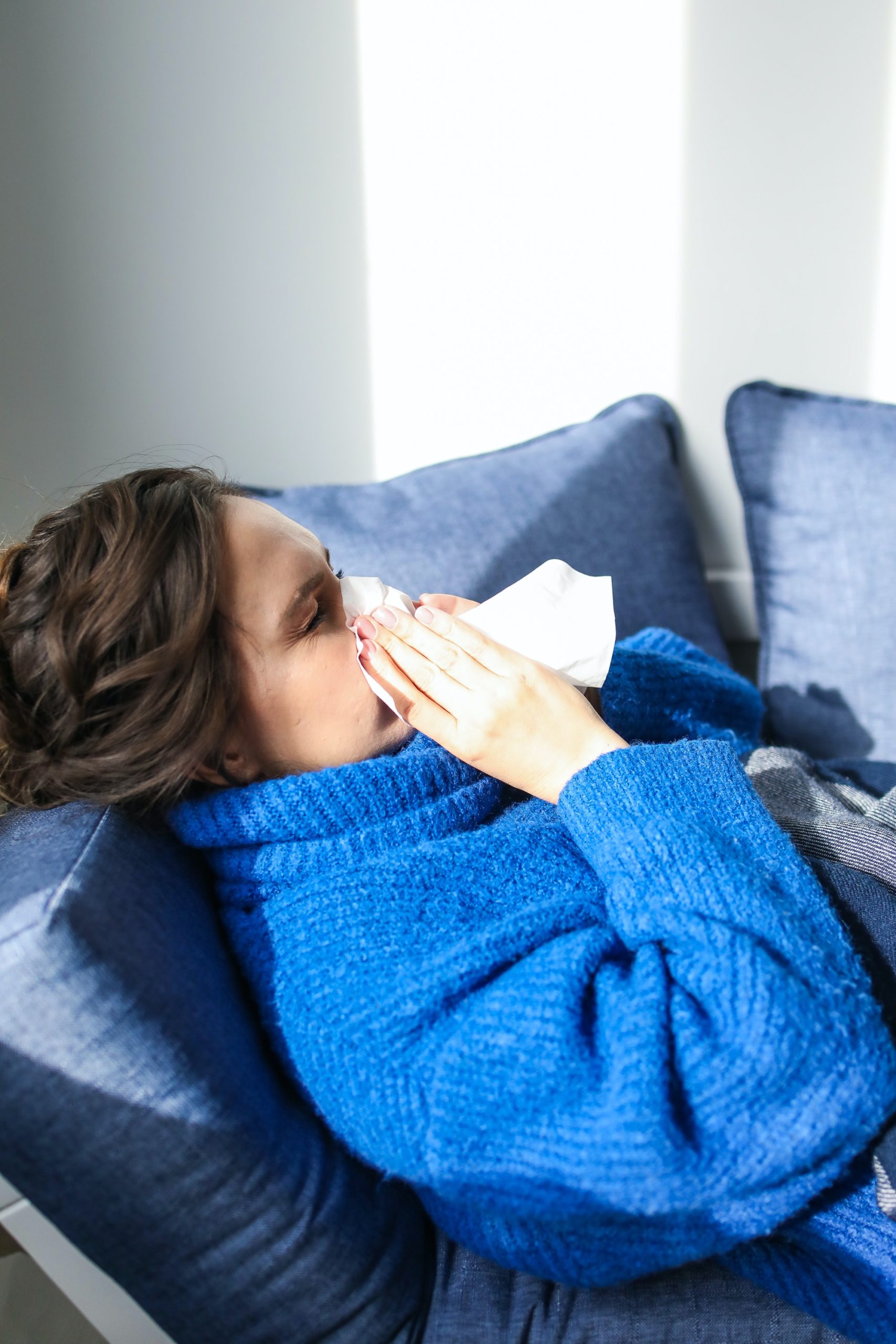 Girl sneezing from allergies in albuquerque